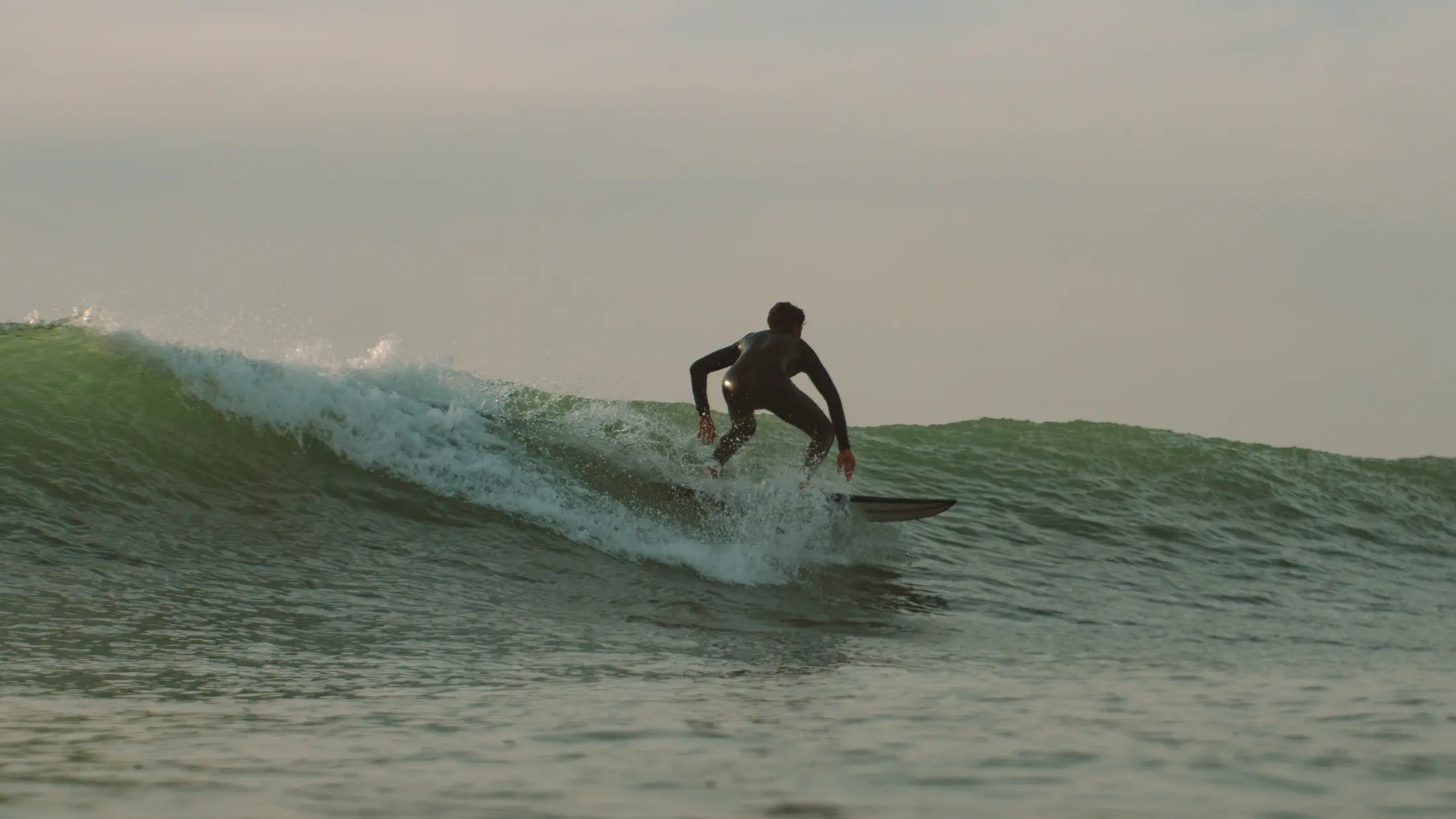 Brahim surfing a clean wave near Tamraght